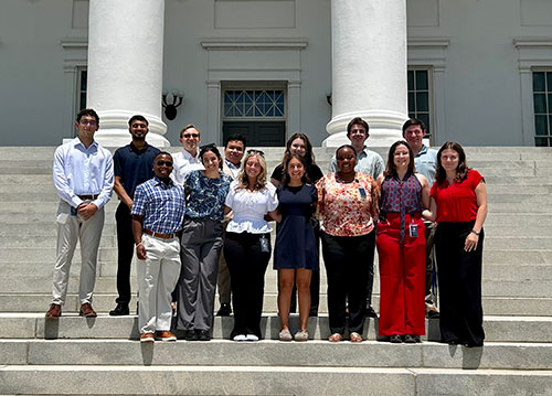 group of students standing on steps of the Capitol